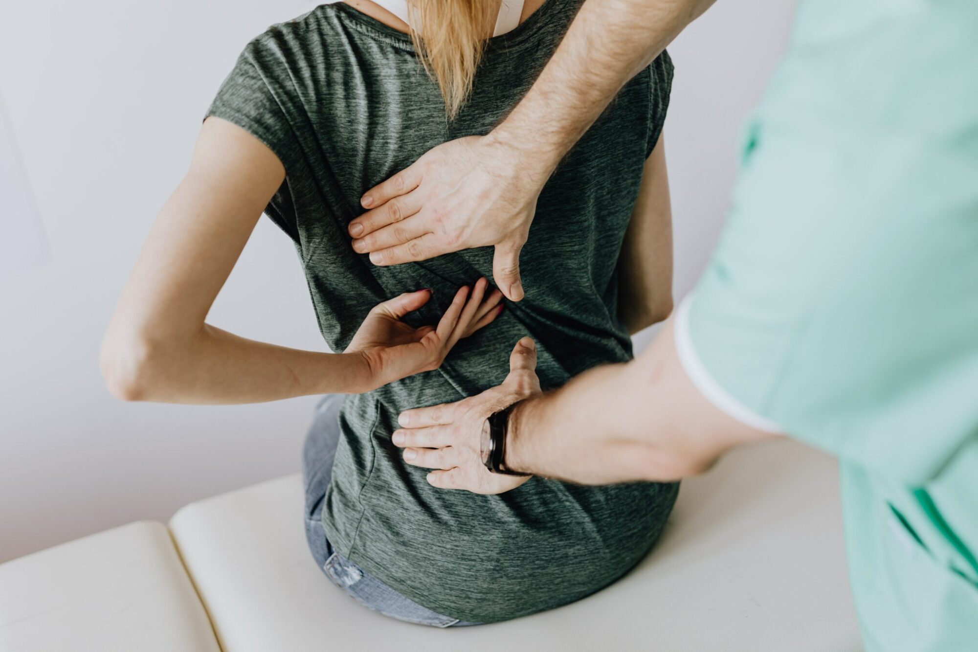 Woman receiving consultation for scoliosis