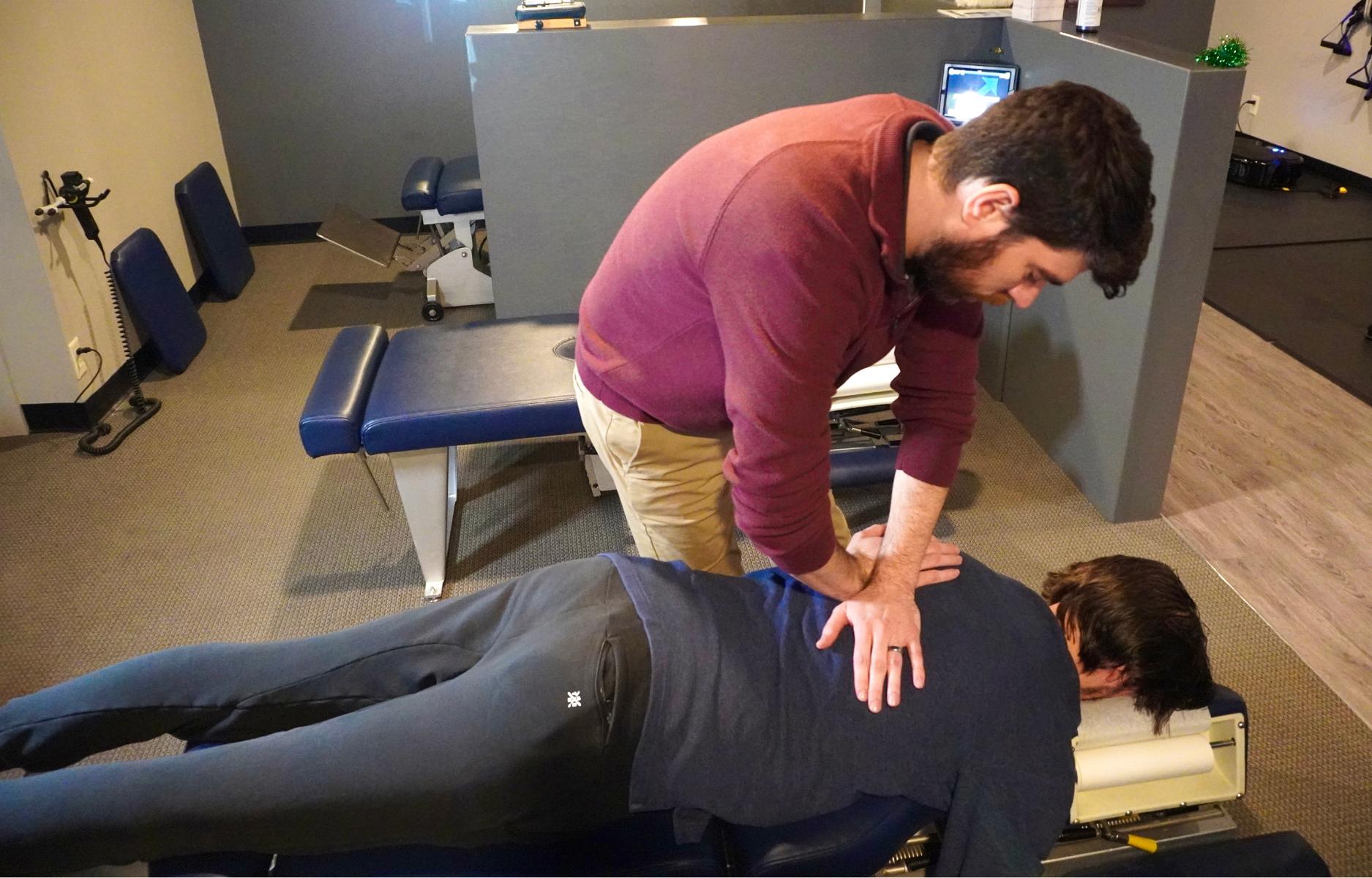 Dr. Herbert providing chiropractic care as part of a scoliosis treatment plan